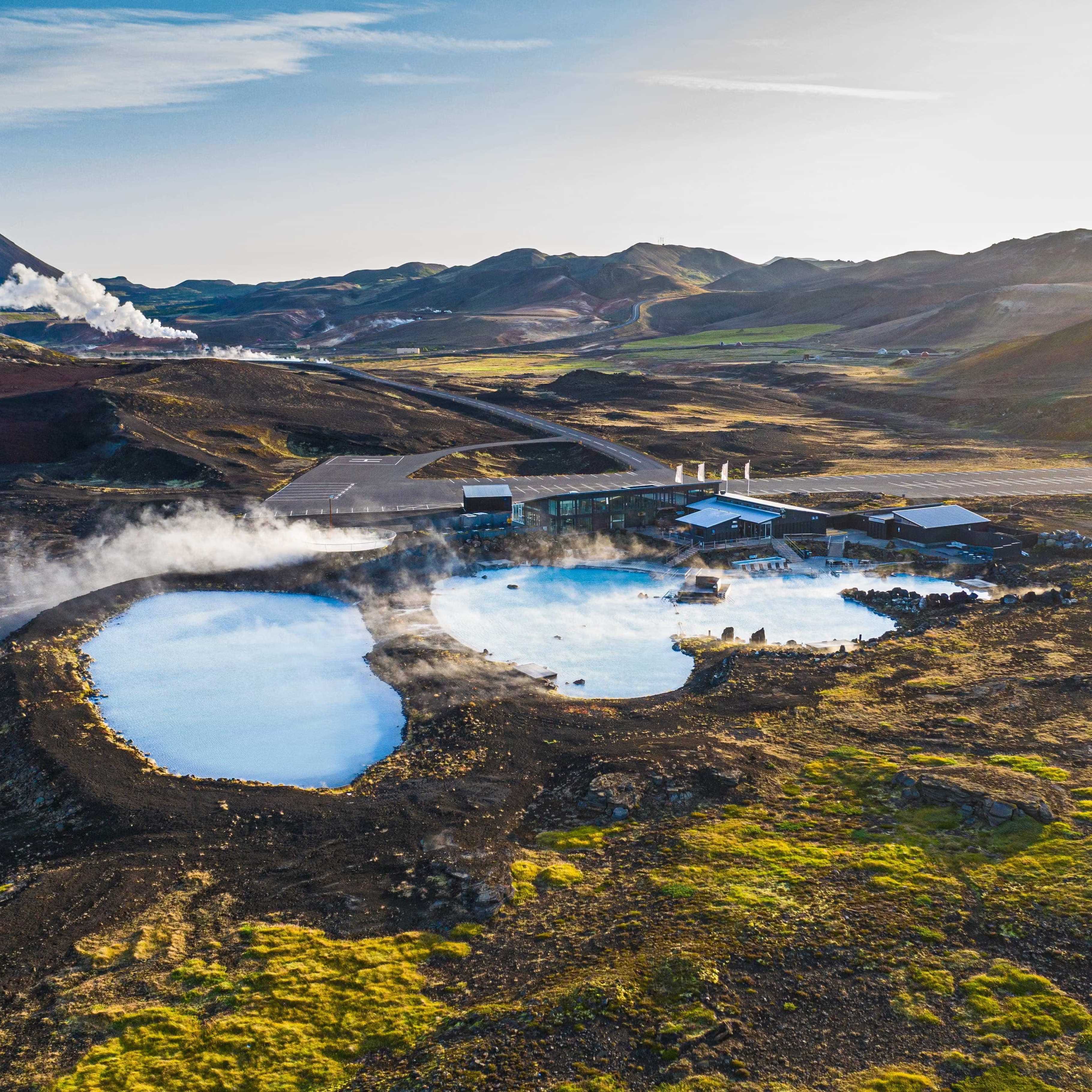 Blue waters of Mývatn Nature Baths with Mountains in the background