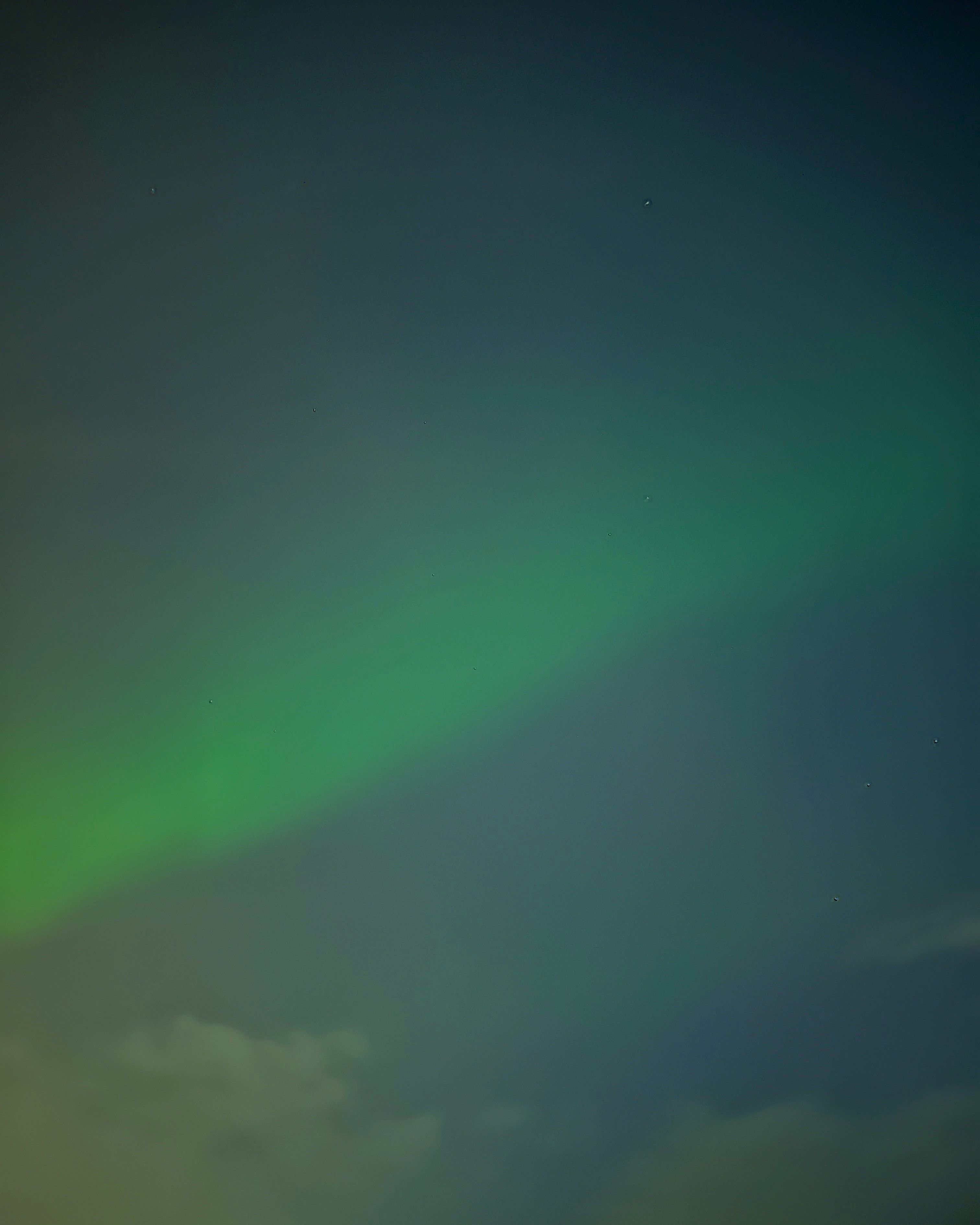 Green aurora in night sky over Iceland